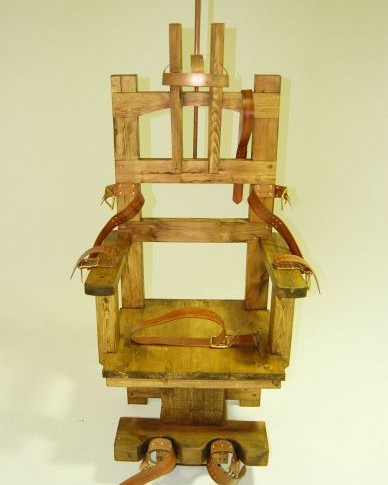 Wooden electric chair with leather restraining straps
