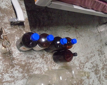 Brown bottle black lid and blue lid