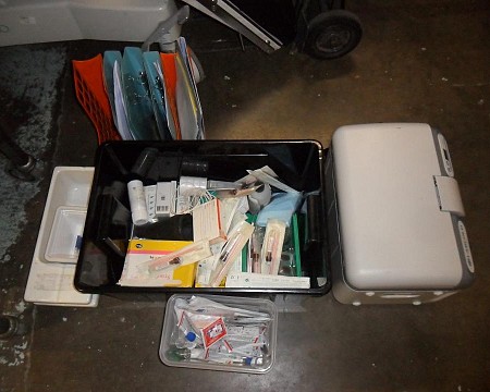 crate of misc vet soft dressing and lin bin